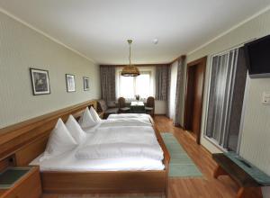 Ein Bett oder Betten in einem Zimmer der Unterkunft Pension Stubachblick