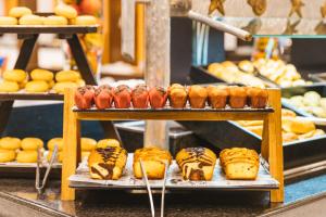 a display of different types of pastries and bread at Hotel LIVVO Volcán Lanzarote in Playa Blanca