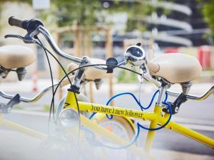 a bicycle with a bicycle handle attached to it at Golden Tulip Bordeaux Euratlantique in Bordeaux