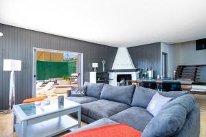 a living room with a couch and a table at Stunning Beachclose Villa by Costarentals - Ref 03 in Fuengirola