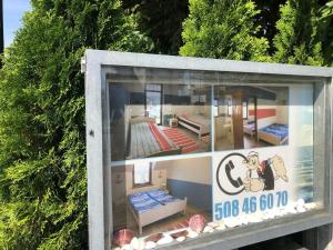 a display window of a room with beds in it at Villa Papaj in Międzyzdroje