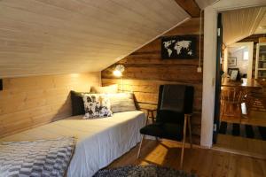 Кровать или кровати в номере Lodge 67°N Lapland