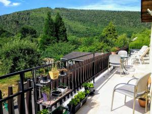 a balcony with a view of a mountain at Les Ecureuils in Revin