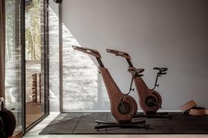 a wooden scooter is parked in a room at OKU Ibiza in San Antonio