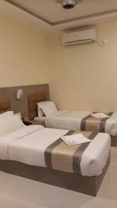 Postel nebo postele na pokoji v ubytování Hotel Saayein Residency