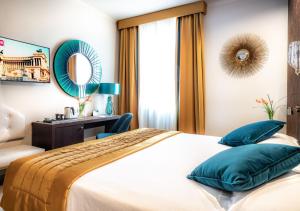 Uma cama ou camas num quarto em FH55 Grand Hotel Palatino