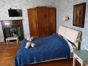 a bedroom with a bed with two teddy bears on it at Villa Melina in Kalymnos