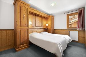 Säng eller sängar i ett rum på Résidence Les Balcons de Val Thorens & Spa