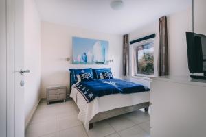 A bed or beds in a room at Villa Georgina