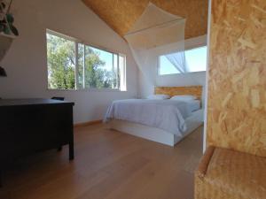 Cama ou camas em um quarto em Domaine Limouzy