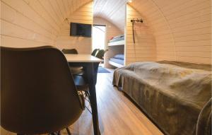 a room with a bed and a desk in a room at Stunning Apartment In Nørre Nebel in Nørre Nebel