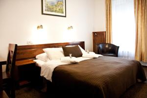 Posteľ alebo postele v izbe v ubytovaní Hotel Pod Orłem