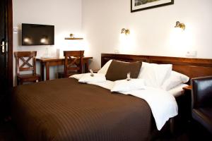 Posteľ alebo postele v izbe v ubytovaní Hotel Pod Orłem