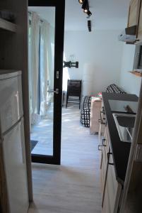 a kitchen with a door leading to a dining room at Tiny House Ruheoase in Zwettl Stadt