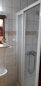 a shower with a glass door in a bathroom at Apartment Perović in Baška Voda +20 photos