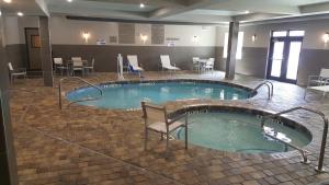 a large swimming pool in a hotel room at Country Inn & Suites by Radisson, Savannah Midtown, GA in Savannah