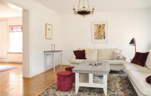 a living room with a couch and a table at 4 Bedroom Gorgeous Home In Lindesberg in Lindesberg