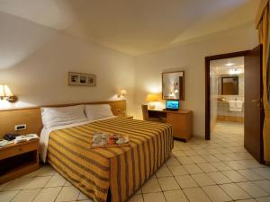 Postel nebo postele na pokoji v ubytování Hotel La Luna