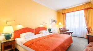 Postel nebo postele na pokoji v ubytování Dvorak Spa & Wellness