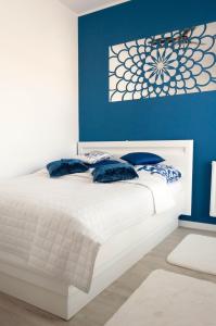 מיטה או מיטות בחדר ב-Apartament Marzanna II