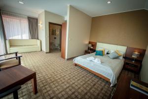 Łóżko lub łóżka w pokoju w obiekcie Hotel Rudnik