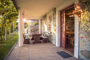 an entrance to a house with a table on a patio at Vineyard Cottage Urban in Mirna