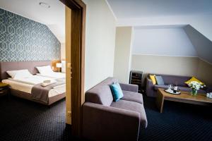 Łóżko lub łóżka w pokoju w obiekcie Hotel Rudnik