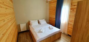 Rúm í herbergi á Hotel Migu Yard
