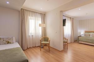 Кровать или кровати в номере Luna Esperanca Centro Hotel
