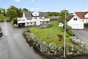 an aerial view of a large white house at Family house close to the beach in Mosterhamn