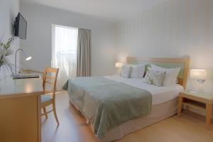 Кровать или кровати в номере Luna Esperanca Centro Hotel