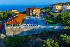 an aerial view of a house with a swimming pool at Villa Voula in Agios Stefanos