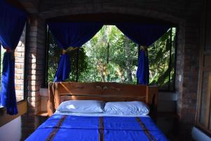 Voodi või voodid majutusasutuse The Mayan Grouper toas