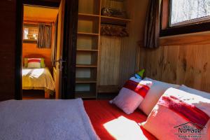 A bed or beds in a room at Maison Nomade