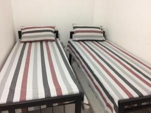 Postel nebo postele na pokoji v ubytování RR House