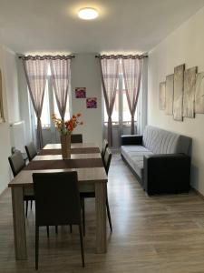 a living room with a table and a couch at Modern Apartment Second Floor in Brussels