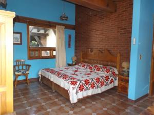 En eller flere senge i et værelse på Casa Paanoramica