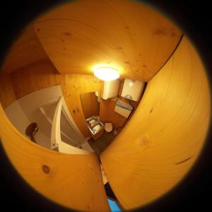 an overhead view of a room in a wooden house at Tiny House Lodge Dresden in Dresden