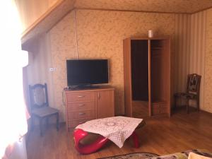 TV a/nebo společenská místnost v ubytování Holiday + 4 fotografie