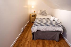 Ένα ή περισσότερα κρεβάτια σε δωμάτιο στο Coral Gables Guesthouse & Campsite