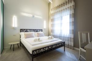 A bed or beds in a room at Borgocinquanta