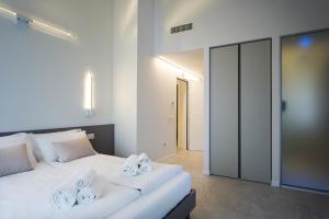 A bed or beds in a room at Borgocinquanta
