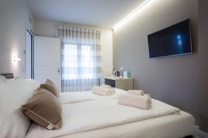 A bed or beds in a room at Borgocinquanta