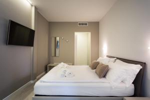 A bed or beds in a room at Borgocinquanta