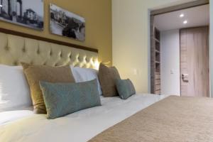 Katil atau katil-katil dalam bilik di Casa Malí by Dominion Boutique Hotel