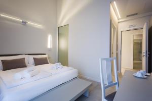 A bed or beds in a room at Borgocinquanta