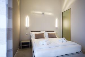 A bed or beds in a room at Borgocinquanta