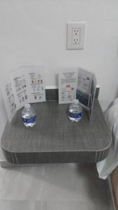 a shelf with two bowls on it in a bedroom at HOTEL EL EDEN IXTAPALUCA in Ixtapaluca +9 photos