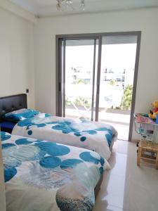 Ένα ή περισσότερα κρεβάτια σε δωμάτιο στο Blanca beach holiday