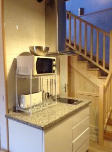 A kitchen or kitchenette at La Cabaña de Bernardina